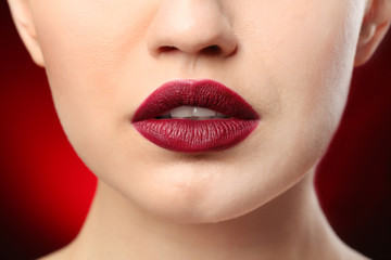 Obraz premium Woman with beautiful makeup on dark background. Professional visage artist work