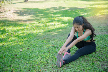 Asian slim woman warm up before work out,slim girl exercise for life,Thailand people,Stretching body before jogging