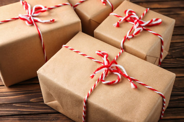 Parcel gift boxes on wooden table, closeup