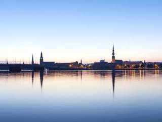 View on Riga cityline panorama in early morning over river Daugava. Panoramic montage from 11 images.