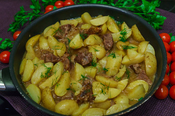 Fresh veal, stewed with potatoes at home.