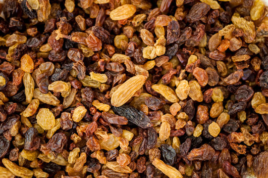 Close-up of yellow and brown raisins.