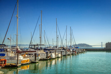 Fototapeta na wymiar Boats and yachts at marina on sunny morning 