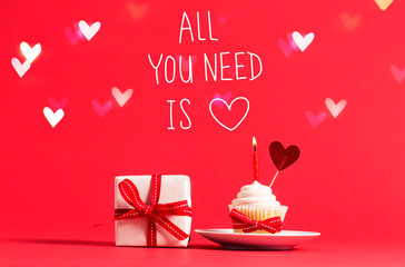 All You Need Is Love message with cupcake and heart ornament