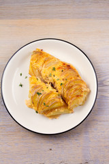 Potato gratin. Baked potato slices with creamy sauce. View from above, top, horizontal