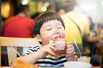 A boy and a pork leg.