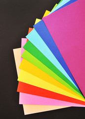 Colorful paper on black background
