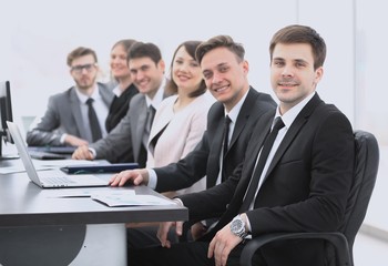 project Manager and professional business team sitting at Desk