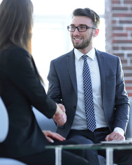 Successful businessmen handshaking after good deal.