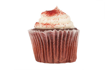 Real close up on a delicious red velvet birthday cupcake, isolated on white background.