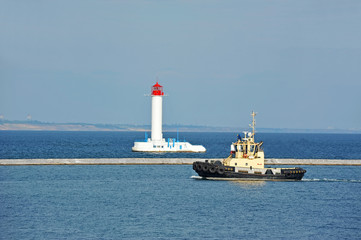 Tugboat and lighthouse
