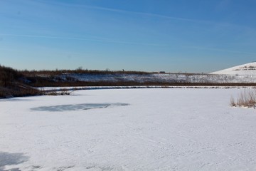 A view of the frozen lake on a beautiful winters morning.
