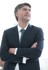 Photo of an attractive businessman with his arms crossed