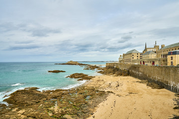 Saint Malo beach, Fort National and rocks during Low Tide. Brittany, France, Europe.  - obrazy, fototapety, plakaty