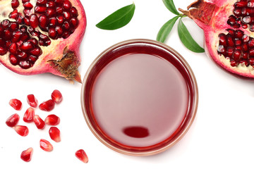 Pomegranate juice with pomegranate isolated on a white background top view