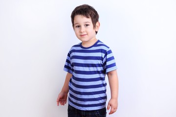 Cute little boy close up studio shoot on white. Family, childhood concept