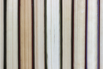 Stacks of colored books on a wooden table. concept of reading habits