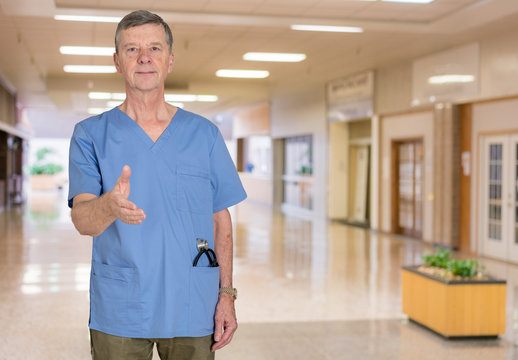 Senior Medical Consultant In Blue Scrubs