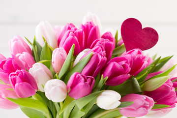 Fototapeta premium Pink tulip on the white background. Easter background