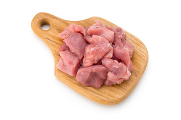 Raw chopped beef meat pieces isolated om white background cut out.