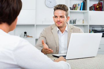 Journalist with  laptop interviews the elderly wealthy woman