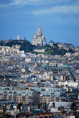 Fototapeta na wymiar A breath taking view of the Sacre Coeur in the distance on a hill overlooking Paris