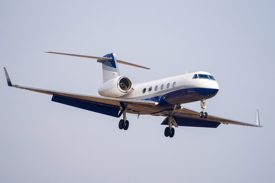 Small private business jet landing at the airport