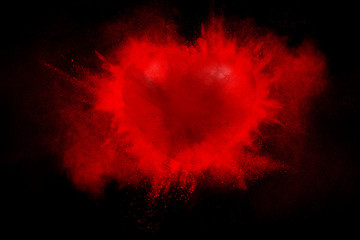 Exploding red heart on a black background