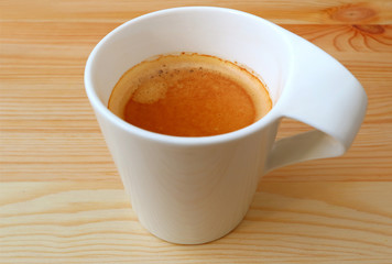 Hot Coffee in white Cup Served on Natural Wooden Table 