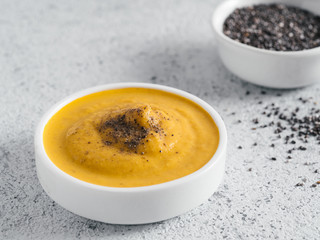 Vegan creamy cheddar cheese sauce with chia seeds