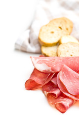 Sliced prosciutto crudo.