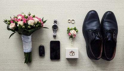 different accessories of a businessman for creating a style of a people lie on a wooden background