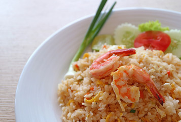 Thai style fried rice with shrimp or Khao Pad Goong on a white plate 
