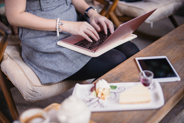 Women hand working on computer notebook in coffee shop