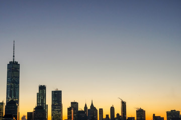 Fototapeta na wymiar Manhattan's Silhouette at sunrise 