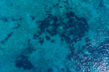 Aerial view on turquoise waves, water surface texture. 