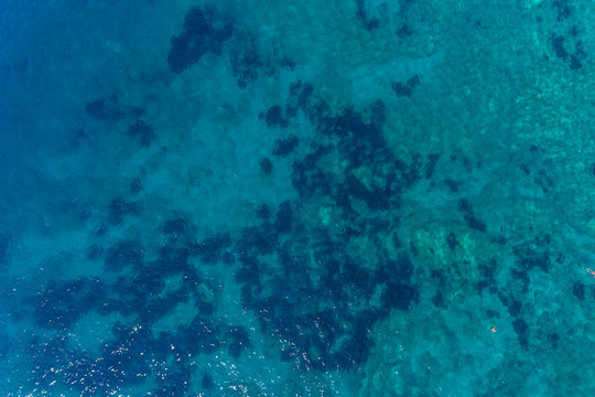 Aerial view on turquoise waves, water surface texture. 