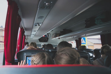 Interior inside of modern bus with passengers.