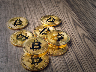bitcoin coin model on wooden board