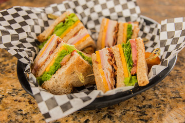 Club Sandwich In Basket On Granite Table