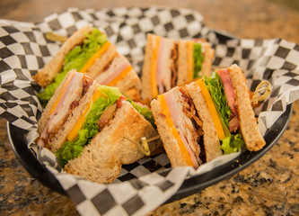 Club Sandwich In Basket On Granite Table
