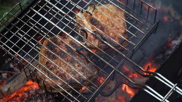 Barbecue with delicious grilled meat on the grill.Barbecue meat is fried grill grate.Grilled meats outdoors.Barbeque on the grill