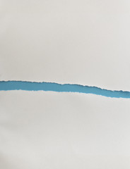 ripped paper isolated on blue background with copy space for text