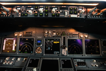 Closeup high detailed view on aircraft control unit in the cockpit of modern civil passenger airplane
