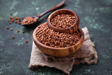 Buckwheat groats in wooden bowl