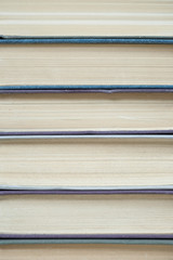 Pile of old books stacked on top of each other