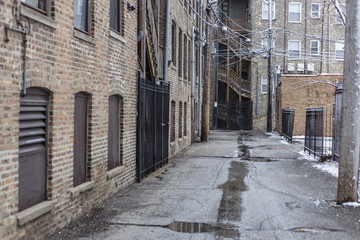 Naklejka na ściany i meble Alleyway in urban area with bricks