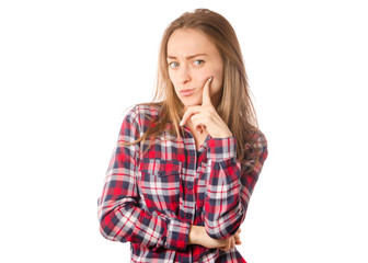 Woman in shirt thinks pensive against