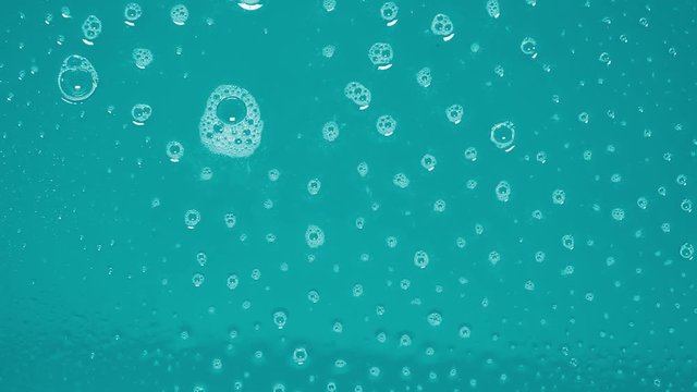 A blue screen diaphanous with soap on it