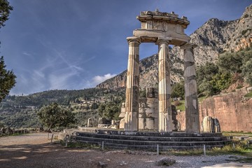 Ruins of Athina Pronaia temple in Ancient Delphi archeological site in Fokida, Greece